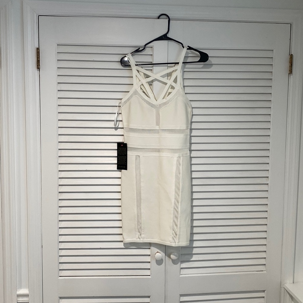 BEBE MESH AND CAGE BANDAGE MINI DRESS